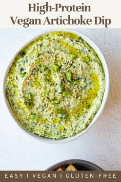 a white bowl filled with broccoli and cheese next to a plate of crackers