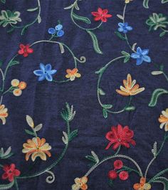 an embroidered fabric with colorful flowers on it