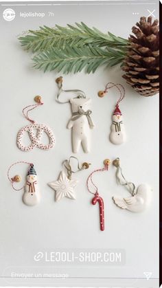 christmas ornaments and pine cone on white background