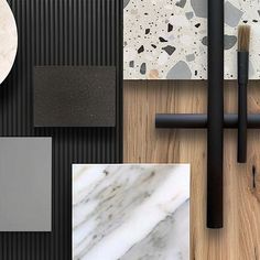 various materials are arranged on the floor with black, white and grey colors in them