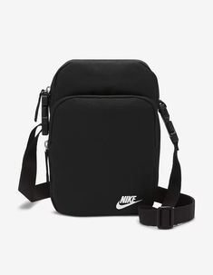 Nike Heritage Crossbody Bag. An Alternative To The Classic Hip Pack Style, The Nike Heritage Crossbody Bag Offers Hands-Free Storage In A Design You Wear Across The Chest. A Futura Logo Print And Easy-To-Adjust Strap Make It A Smart Pick For Everyday Use. The Main Storage Pocket And Accessories Pocket Help Keep Your Gear Organized. This Product Is Made With At Least 65% Recycled Polyester. Zippered Main Pocket Helps Keep Your Bigger Items Organized And Stored Securely. Zippered Accessories Pocket Provides Secure Small-Item Storage. Adjustable Strap Provides A Personalized Fit. Dimensions: 9" H X 7" W X 3" D. 4 L. Body: 69% Nylon, 31% Polyester. Lining: 100% Polyester. Spot Clean. Imported. Nike Crossbody Bag, Mochila Nike, Nike Sb Zoom, Nike Bags, Small Item Storage, Nike Blazer, Black Crossbody, Black Cross Body Bag, Sport Bag