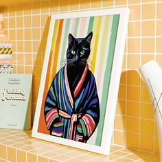 a painting of a black cat wearing a colorful kimono on a tiled counter top