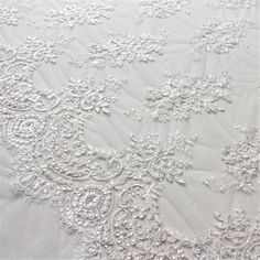 "This stunning Lace Fabric design piece has soft hand feel, It's perfect for weddings, bridal parties, and any events. Shop our large inventory of bridal fabrics. ☆PRODUCT DESCRIPTION : This gorgeous fabric is made on a sheer base with a beautiful flower embroidery throughout. The fabric width is approximately 51\" (130cm) Wide. Color: off-white as in picture Material: Rayon, Polyester ☆ PURCHASING INFORMATION: This fabric is sold by the yard and each Qty you enter will represent 1 yard of fabri Embroidery Tulle, Corded Lace Fabric, Night Gowns, Bridal Lace Fabric, Embroidered Lace Fabric, Bridal Fabric, Fancy Beads, Wedding Dress Fabrics, Corded Lace