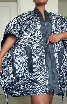 Dear to wear something different, with this beautiful stylish oversized African Tie Dye kimono jacket. Made with soft and comfortable %100 cotton fabric, this knee-length jacket features a stylish black and white color with African pattern design, large  front pockets, this is perfect for any occasion, whether it's party, casual, workwear, or business. The 3/4 kaftan sleeves with front opening  add a unique touch to the jacket, making it supper convenient to put on. This stunning African tye dye kimono jacket can be worn and paired in so many different ways. it's a beautiful silhouette that complements any size and shape.  Crafted by hand with love and care, this jacket is a must-have for any fashion-conscious woman. Its collared design, along with the all-seasons features, make it an idea Oversized Cotton Kaftan, White Cotton Outerwear With Kimono Sleeves, Black Cotton Outerwear With Kimono-style Sleeves, Black Cotton Outerwear With Kimono Sleeves, Oversized Cotton Outerwear With Kimono Sleeves, White Oversized Cotton Kaftan, Casual Cotton Kaftan With Kimono Sleeves, Cotton Long Sleeve Kaftan For Fall, Long Sleeve Cotton Kaftan With Relaxed Fit