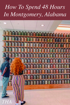 two people standing in front of a book shelf filled with books and jars that read how to spend 48 hours in montgomery, alabama