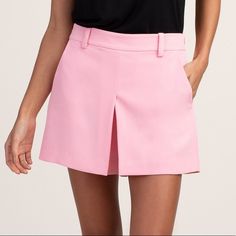 New With Tags Trina Turk Solar Short Pink An Overall Clean And Sleek Look. The High-Rise Short Features A Relaxed Hip And Thigh And Has A Slightly Flared Silhouette To This Modern Skort, A Shorts And Skirt Combo. Wear As A Weekend-Casual Look, Paired With A Tee, Or Dress It Up With A Silk Blouse And Heels For A Night Out. Belt Loop Waistband Concealed Side Zip Closure Inverted Front Pleat Side Slash Pockets Inseam: 4", Front Rise: 11.38" True To Size 100% Polyester Made In: United States Chic Pink Skort For Workwear, Spring Workwear Skort In Short Length, Pink Mini Length Bottoms For Work, Pink Short Length Skort For Work, Chic Pink Shorts, Pink Bottoms With Short Inseam For Workwear, Pink Skort For Spring Workwear, Short Skort For Workwear In Spring, Short Skort For Spring Workwear