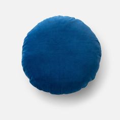 a blue round cushion on a white background