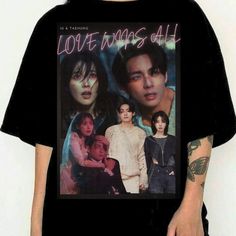 a man wearing a black t - shirt with the cover of love was all on it