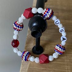 Red White and Blue Patriotic Bracelet A handmade stretchy bracelet crafted in Colorado by my cat. BEADS: glass beads, plastic beads FIT: stretchy bracelet that fits adult wrists VIBE: I love the USA! FREEBIE: Comes in a cute fabric gift bag with a gift tag I started making beaded necklaces to sell on Etsy about 5 years ago! I slowly learned how by buying lots and lots of supplies online. My favorite beads for my stretchy bracelets are ceramic animal charms. I have many fun designs to choose from Cat Beads, Patriotic Bracelet, Fabric Gift Bag, Cute Fabric, Ceramic Animals, Stretchy Bracelets, Fabric Gift Bags, Bracelet Crafts, Fun Designs