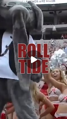 a person in a mascot costume is dancing at a basketball game