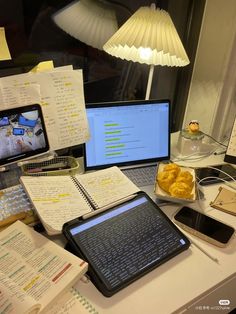 a laptop computer sitting on top of a desk