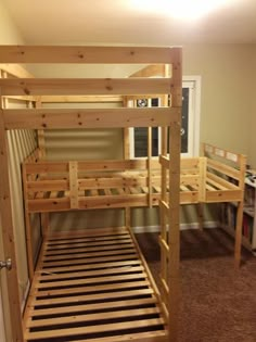 a wooden bunk bed sitting next to a doorway