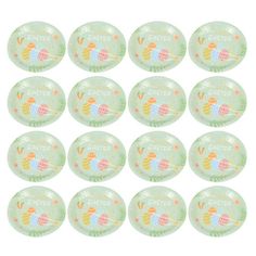 twelve plastic easter plates with colorful designs on the front and sides, all in pastel green