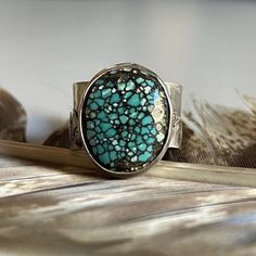 Gorgeous turquoise bezel set in sterling silver on top of a half inch wide, hammered sterling silver ring mountain band with a brass sun. this ring was inspired by my love for Asheville and the blue ridge mountains in NC. Hurricane Helene has caused so much damage to this beautiful town and the people. I created this ring to help support the community. the proceeds from these mountain rings will be donated to @belovedasheville  Boho style, southwest style- perfect for everyday wear. Ring size 8 Handmade in my mobile jewelry studio. Turquoise, the captivating sea-green stone of the ancients, represents wisdom, tranquility, protection, good fortune, and hope. Unique Hand Forged Turquoise Ring, Silver-setting Turquoise Cabochon Ring, Nickel-free Round Turquoise Southwestern Ring, Mountain Ring, Nickel-free Bohemian Turquoise Ring, Blue Multi-stone Turquoise Ring In Sterling Silver, Sterling Silver Rings Turquoise, Hammered Sterling Silver, Sterling Jewelry