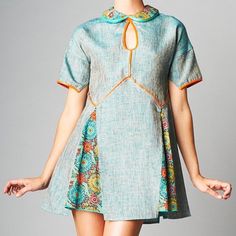 This Dress Artfully Combines A Mix Of Prints Atop A Pleated Skirt, While A Keyhole Cutout Heightens Showstopping Style. Orange And Teal Lining Is Faux Leather. Dress Appears In Person Slightly Darker Than Original Model Photos. 50% Cotton / 20% Rayon / 20% Polyester / 10% Faux Leather Dry Clean Only Xl (10-12) Armpit To Armpit: 21" Flat; Under Bust : 18.5" Flat; Hollow To Hem: 32.5"" Summer Patchwork Mini Dress With Short Sleeves, Summer Mini Dress With Patchwork And Short Sleeves, Spring Short Sleeve Mini Dress With Patchwork, Summer A-line Mini Dress With Patchwork, Fitted Mini Dress With Patchwork And Short Sleeves, Fitted Short Sleeve Patchwork Mini Dress, Fitted Patchwork Mini Dress With Short Sleeves, Orange Cutout Dress, Faux Leather Dress