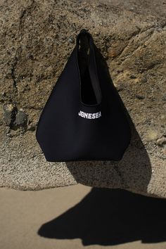 Hobo Beach Bag – Jonesea Wetsuits Black Bucket Bag For Beach, Functional Summer Tote Shoulder Bag, Functional Beach Bags For Summer, Functional Summer Beach Bags, Summer Weekend Shoulder Beach Bag, Beach Tote Bag With Dust Bag Included, Functional Rectangular Shoulder Bag For Beach, Functional Everyday Beach Bag For Summer, Functional Rectangular Beach Bag