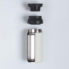 thermos are placed next to each other on a white surface with black accents