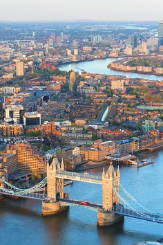 an aerial view of london with the tower bridge in the foreground