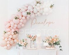 a table topped with balloons and flowers next to a sign that says bridale