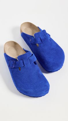 Upper: Cowhide suedeMolded footbedAdjustable buckle strapRound toeRubber soleMade in GermanyThis item cannot be gift-boxedStyle #BIRKE30515 Blue Slip-on Clogs With Cork-bed Midsoles, Casual Blue Mules With Leather Footbed, Blue Suede Clogs With Round Toe, Blue Suede Slip-on Clogs, Blue Clogs With Leather Footbed And Round Toe, Birkenstock Boston Clogs, Ultra Blue, Birkenstock Sandals Arizona