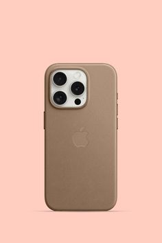 an iphone 11 pro is shown with the back camera facing up on a pink background