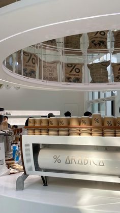 an array of coffee cups on display in a store