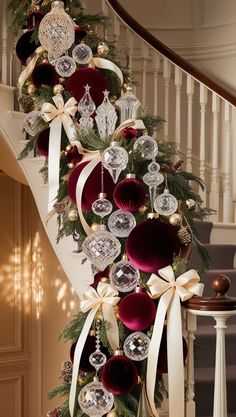 a christmas tree decorated with ornaments and bows on the bannister wall in front of stairs