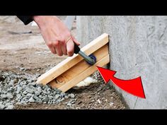 a person is using a hammer to cut wood