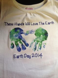 a t - shirt that says, these hands will love the earth with two handprints on it