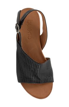 Scalloped perforations blanket the upper of a sun-ready sandal fashioned from luxe leather for comfortable strides. Adjustable slingback strap with buckle closure Leather upper and lining/rubber sole Made in Turkey Leather Wedge Sandals With Woven Leather Ankle Strap, Leather Slingback Wedge Sandals With Buckle, Woven Leather Slingback Sandals, Leather Wedge Sandals With Woven Detail And Ankle Strap, Woven Leather Open Toe Slingback Sandals, Beach Slingback Slip-on Sandals With Buckle Closure, Leather Slingback T-strap Sandals With Buckle Closure, Adjustable Buckle Closure Slip-on Sandals, Spring Buckle Closure Slip-on Sport Sandals