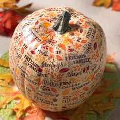 a decorative pumpkin with words written all over it