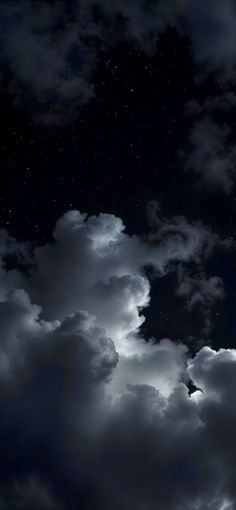 the night sky is full of clouds and stars