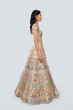 Multicolored yellow heavy embellished and applique kali tissue lehenga with blouse and scallop net dupatta. Floor-length Lehenga With Multicolor Embroidery For Diwali, Yellow Chanderi Lehenga With Mirror Work, Designer Floor-length Sets With Multicolor Embroidery, Floor-length Multicolor Embroidered Designer Sets, Yellow Kundan Set With Intricate Embroidery, Yellow Sets With Intricate Embroidery For Reception, Yellow Gown For Reception During Navratri, Multicolor Embroidered Gown With Zari Work For Navratri, Navratri Gown With Multicolor Embroidery And Zari Work