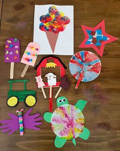 paper crafts and crafting supplies laid out on a wooden table