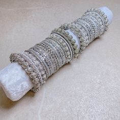 Large stack of luxurious Silver bangles with pearl details, sparkling silvers & white shades. Chunky Silver & Zircon Clear crystals ends and our stunning daisy bangles make this the perfect stack for any Bride or those wanting to make a statement.  Sold as 2 arm stack only. Ready to Ship! Arm Stack, Hand Harness, White Shades