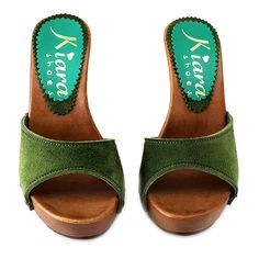 Wood-effect Clogs with green suede upper. Heel 11 cm. Elegant und comfortable, completely handmade in Italy. Craftsman-made Casual Green Open-heel Mules, Green Open Heel Mules, Green Suede Closed Toe Sandals, Green Clogs With Rubber Sole And Round Toe, Green Leather Slip-on Clogs, Green Casual Mules With Wooden Heel, Casual Green Mules With Wooden Heel, Green Closed Toe Sandals With Wooden Heel, Green Clogs With Rubber Sole And Closed Toe