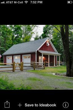 an image of a small red house in the middle of a field with trees and grass