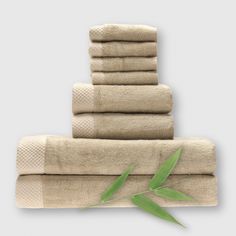 8 piece tan champagne bamboo towel stack showing basket weave edge and a bamboo plant Laundry Time, Textile Factory, Bamboo Towels, Towel Sets, Spa Towels, Pool Time, Mattress Pads, Dishwashing Liquid, Soft Towels