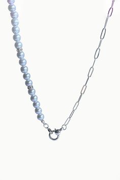 A brand new entry to our summer jewels collection, Mika necklace showcases a strand of lustrous white pearls, silver zircon spacers and sterling silver paperclip chain, elegantly secured with a silver anchor clasp. Pair Mika with delicate pearl earrings to achieve a perfectly coordinated look. White Freshwater Pearls Zircon Studded Silver Spacers Paperclip Chain - Sterling Silver Pearl: Love - Beauty - Wealth Anchor Silver Clasp Pearl Size: 6mm apx. Necklace Length: 20" Silver Pearl Necklace With Chain, Elegant Silver Chain Necklace With Pearl Charm, Elegant Silver Necklace With Pearl Charm, Elegant Pearl Chain Necklace With Silver Chain, Classic Silver Chain Necklace With Pearls, Elegant Silver Necklace With Paperclip Chain, Everyday Silver Pearl Chain Necklace, Formal Silver Chain Necklace With Pearls, Elegant Pearl Necklace With Paperclip Chain