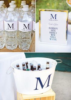 bottles of bottled water are on display in buckets and next to a sign with the letter m