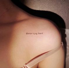 a woman's chest with the words forever is my heart written on it