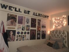 a bedroom with lights and pictures on the wall