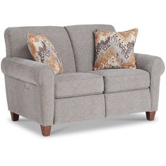 a gray couch with two pillows on it