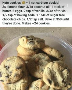 a plastic container filled with cookies on top of a table