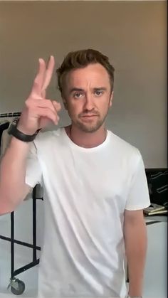 a man making the peace sign with his hand