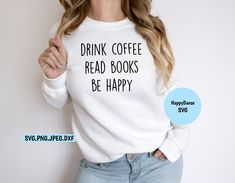 a woman wearing a white sweatshirt with the words drink coffee read books be happy on it