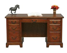 a wooden desk with two drawers and a horse figurine sitting on top of it