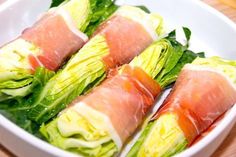 lettuce wrapped in fish and garnished with sauce