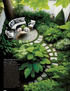 an outdoor garden with green plants and chairs in the center, surrounded by greenery