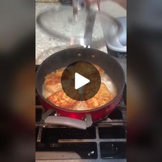 a frying pan filled with food on top of a stove